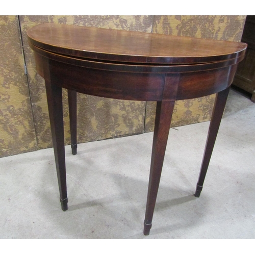 2236 - Georgian mahogany demi-lune fold over top tea table on square taper legs 81 cm diameter