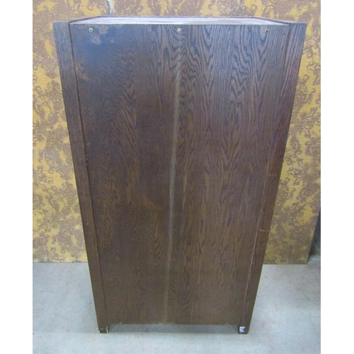 2244 - A pair old English style oak wardrobe with Tudor Rose detail, applied iron work set within a panelle... 