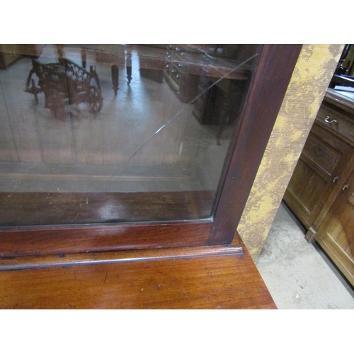 2258 - A small Victorian mahogany library bookcase, the lower section enclosed by two panelled doors and a ... 