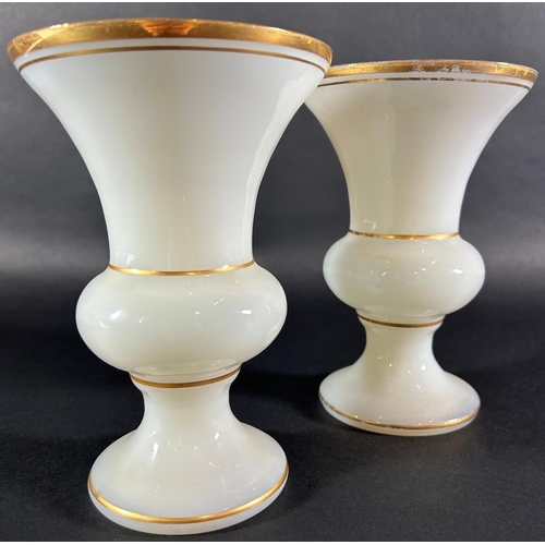 A pair of 19th century opaline glass vases with gilded rims, 17.5cm high