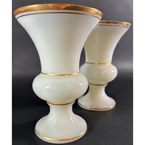 1201 - A pair of 19th century opaline glass vases with gilded rims, 17.5cm high