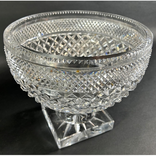 1203 - A large diamond cut glass punch bowl raised on a square base, 24cm diameter x 21cm high, together wi... 