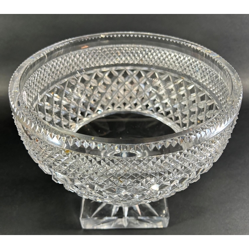 1203 - A large diamond cut glass punch bowl raised on a square base, 24cm diameter x 21cm high, together wi... 