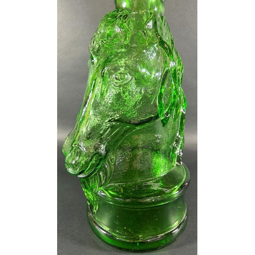 1204 - A tall green glass bottle in the form of a unicorn with spiral neck, 69.5cm high