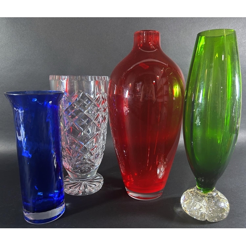 1212 - A mixed selection of mid to late 20th century glassware to include a tall red vase, a pale blue frui... 