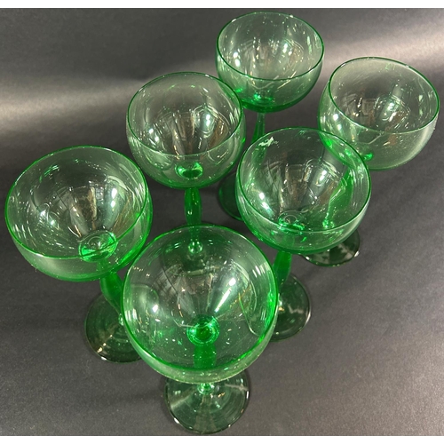 1215 - Six slender green hock wine glasses, 195cm high