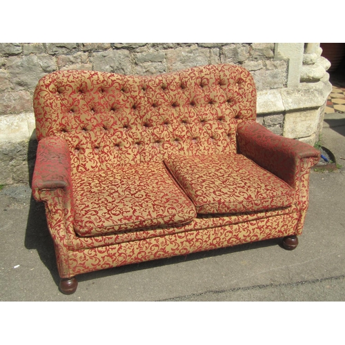 2331 - An Edwardian button back drawing room sofa of small proportions 130 cm wide together with a chair in... 