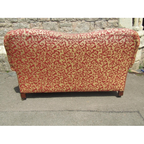 2331 - An Edwardian button back drawing room sofa of small proportions 130 cm wide together with a chair in... 