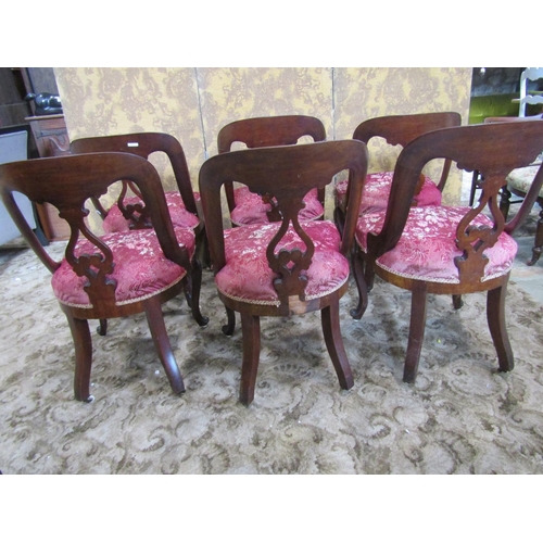 2346 - A set of six Victorian mahogany dining chairs with horseshoe shaped backs, carved and pierced splats... 