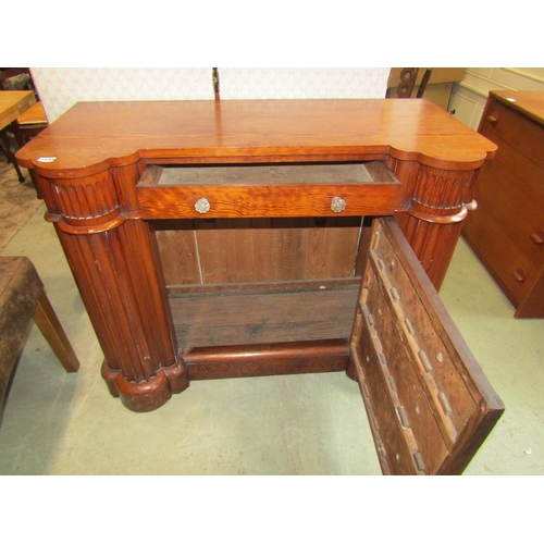 2287 - An unusual Victorian pitch pine chest of four drawers flanked by a pair of pronounced fluted columns... 