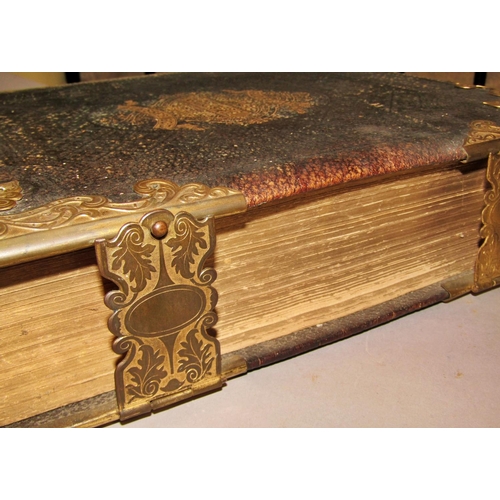 215 - Seven of Victorian family bibles, all with black bindings, some with clasps