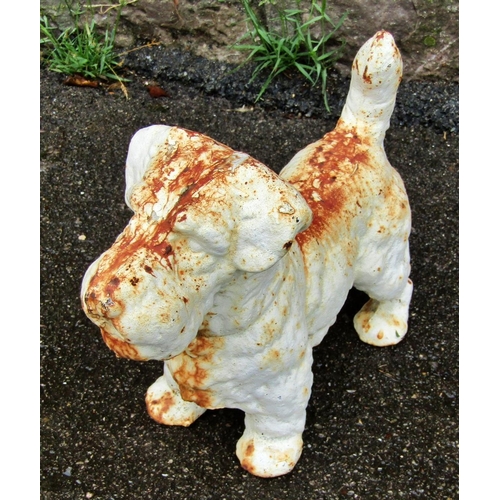 2066 - A small weathered cast iron garden ornament or door stop in the form of a standing terrier, 23cm hig... 