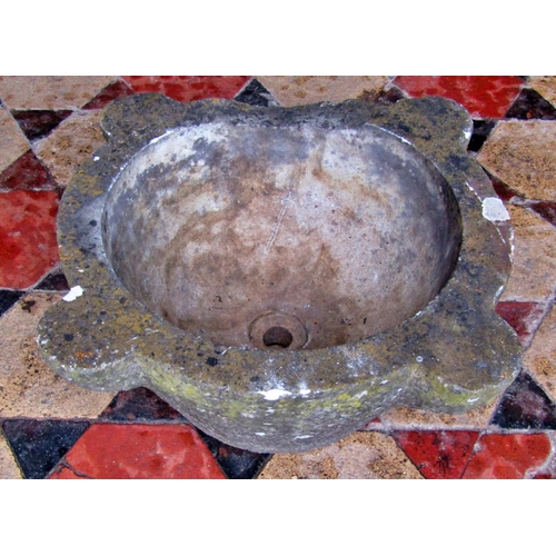 2068 - A weathered carved marble mortar, with later drainage hole, 44cm across x 18cm high (af)