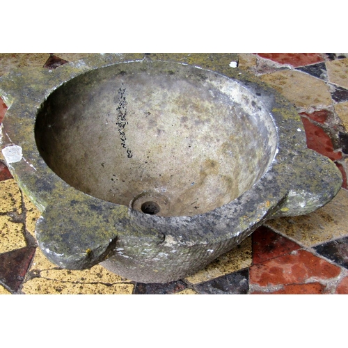 2068 - A weathered carved marble mortar, with later drainage hole, 44cm across x 18cm high (af)