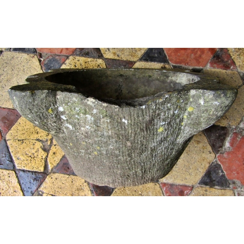 2068 - A weathered carved marble mortar, with later drainage hole, 44cm across x 18cm high (af)