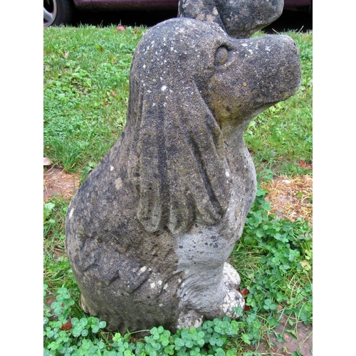 2078 - A pair of nicely weathered cast composition stone garden ornaments in the form of seated spaniels, 5... 