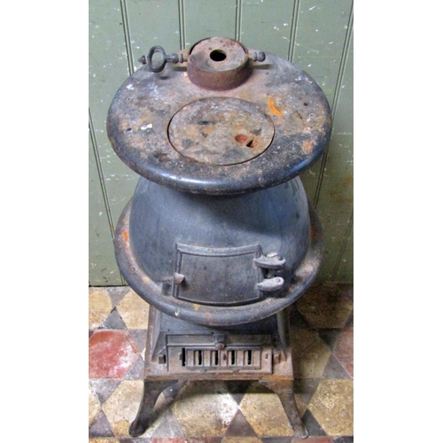 2089 - A cast iron pot bellied stove raised on swept supports, 84cm (full height)