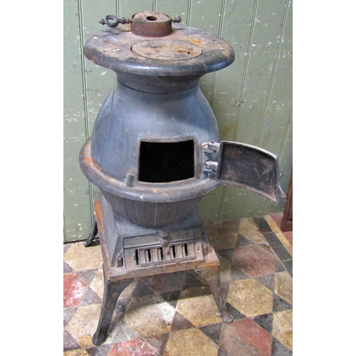 2089 - A cast iron pot bellied stove raised on swept supports, 84cm (full height)