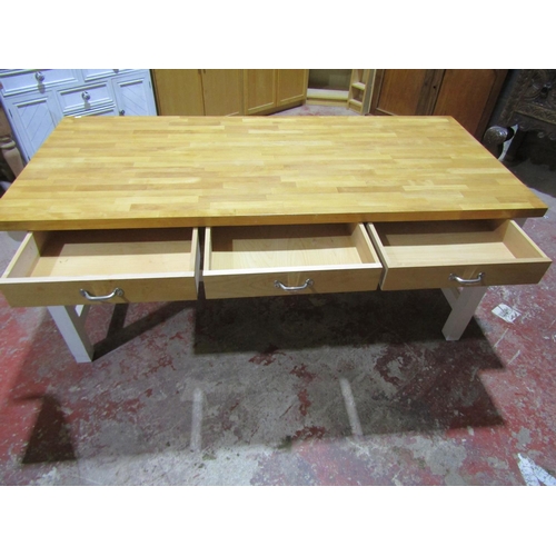 2462 - A contemporary pine kitchen/work table with three frieze drawers over painted supports and stretcher... 