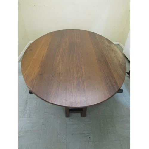 2475 - A large hardwood occasional centre table in a Japanese design, the oval top raised on eight square c... 