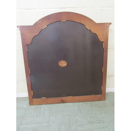 2476 - A continental carved oak over-mantle mirror, of arched form with  bevelled glass plate, 112 cm x 117... 