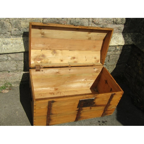 2292 - 19th century stripped and waxed pine trunk with domed lid, steel bands and lock plate, 90cm wide