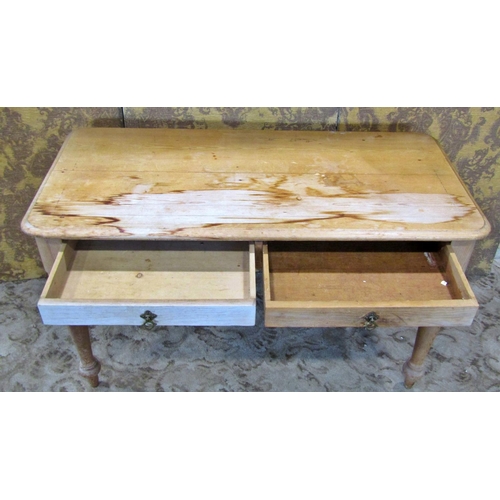 2302 - A Victorian stripped pine side table fitted with two drawers on turned supports, 112cm wide