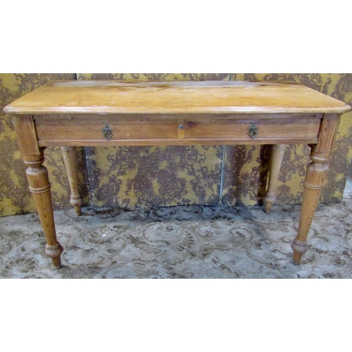 2302 - A Victorian stripped pine side table fitted with two drawers on turned supports, 112cm wide