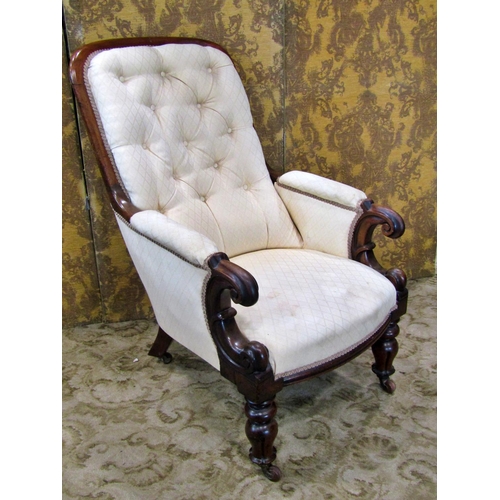 2311 - A Victorian mahogany framed drawing room chair with scrolled arms and upholstered framework