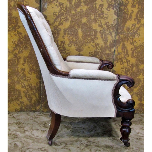 2311 - A Victorian mahogany framed drawing room chair with scrolled arms and upholstered framework