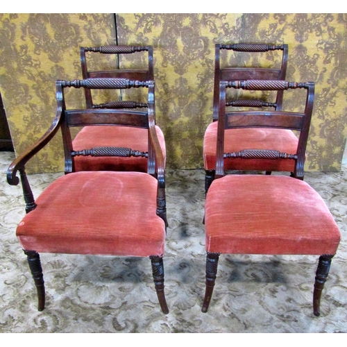 2313 - A set of four Regency mahogany dining chairs one elbow and three matching singles, all with rope twi... 