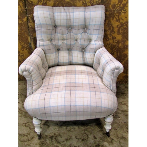 2318 - An upholstered easy chair with button back on turned supports