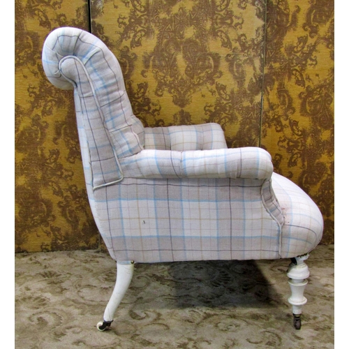 2318 - An upholstered easy chair with button back on turned supports