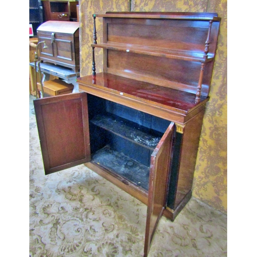 2328 - A Regency rosewood chiffonier enclosed by two panelled doors, raised back incorporating two shelves ... 