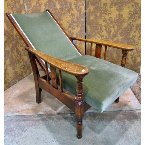 2332 - An Arts & Crafts oak reclining chair with re-upholstered finish