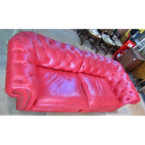 2344 - A Victorian style Chesterfield sofa with button finish, upholstered in a red leather colourway, 240 ... 