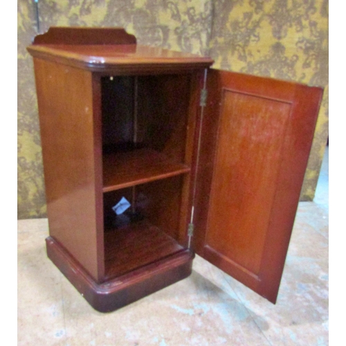 2167 - A Victorian mahogany bedside cupboard enclosed by a moulded arched panelled door