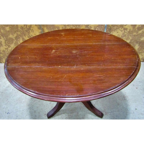 2169 - A late Victorian walnut oval tilt top table raised on a turned pillar and tripod, the top 97 cm x 70... 