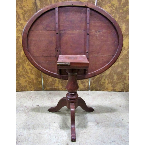 2169 - A late Victorian walnut oval tilt top table raised on a turned pillar and tripod, the top 97 cm x 70... 