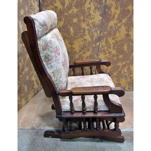 2172 - A late 19th/early 20th century walnut rocking chair with later upholstered pad seat and back within ... 