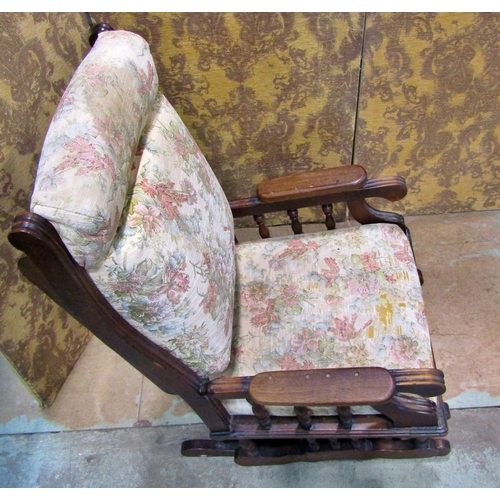 2172 - A late 19th/early 20th century walnut rocking chair with later upholstered pad seat and back within ... 