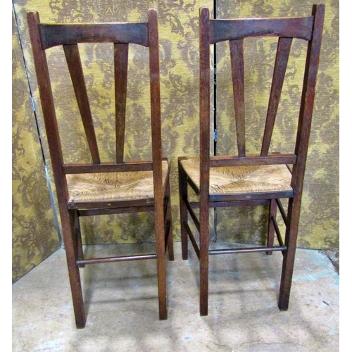 2176 - A Regency stained beechwood curved bar back lightweight open elbow chair with scrolled arms over a c... 