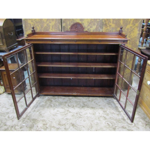 2177 - A late Victorian/Edwardian mahogany freestanding bookcase/side cabinet enclosed by a pair of rectang... 