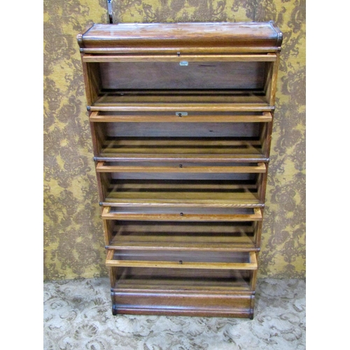 2178 - A Globe Wernicke & Co Ltd oak floorstanding five sectional library bookcase with 'up and over' recta... 