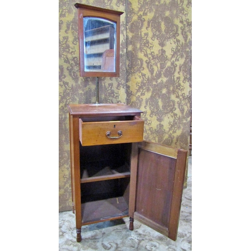 2179 - An Edwardian walnut shaving stand with raised adjustable mirror over a drawer and cupboard on turned... 