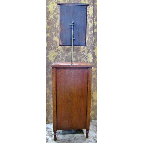 2179 - An Edwardian walnut shaving stand with raised adjustable mirror over a drawer and cupboard on turned... 