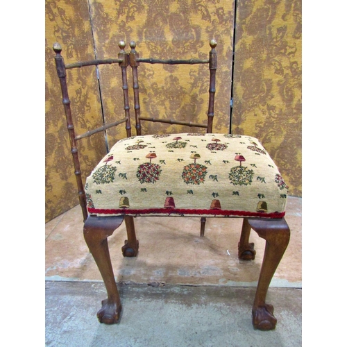 2184 - An Edwardian dressing stool with later re-upholstered rectangular seat raised on claw and ball suppo... 