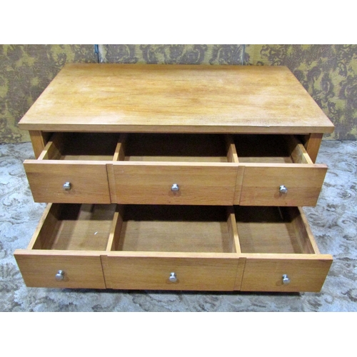 2191 - A contemporary low medium oak chest of two long drawers disguised as six short, raised on square cut... 