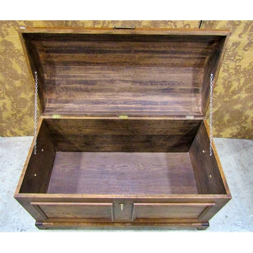 2200 - An oak domed top chest with pierced brass lasp and drop side carrying handles, 103 cm long x 53 wide... 