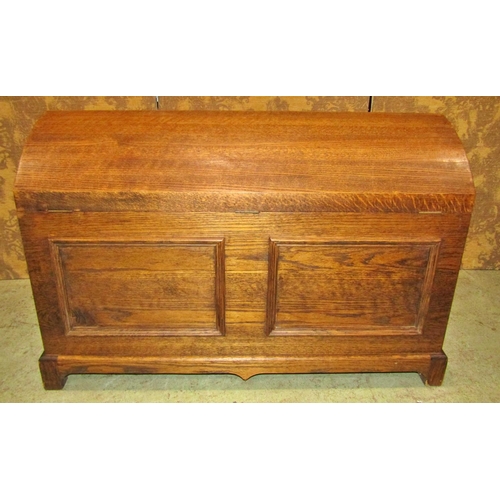 2200 - An oak domed top chest with pierced brass lasp and drop side carrying handles, 103 cm long x 53 wide... 